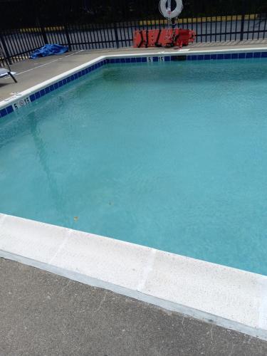 a large swimming pool with blue water at Sleep Inn in Lexington
