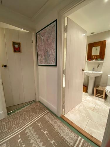 a bathroom with a toilet and a sink at North View B&B in Penrith