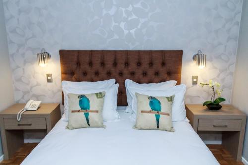 Ліжко або ліжка в номері HOTEL ALONSO DE ERCILLA