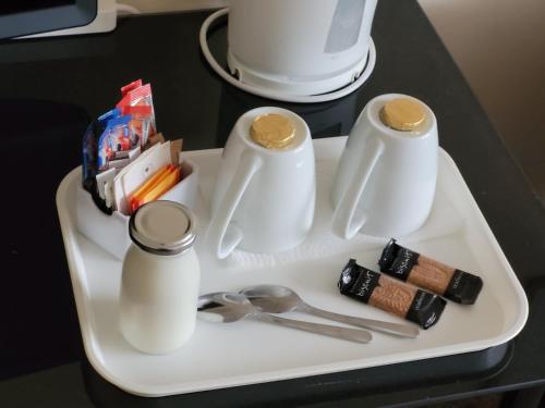 a white tray with utensils on top of a table at Hampton Lodge En-Suite Rooms with Free Parking in Stratford-upon-Avon