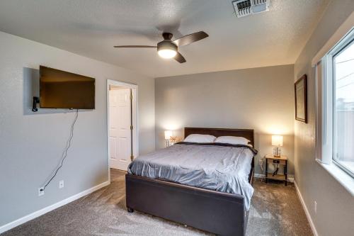 a bedroom with a bed and a ceiling fan at Fire Pit and Covered Patio Bullhead City Escape! in Bullhead City