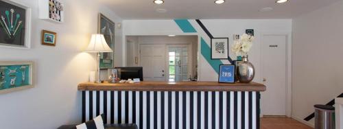 a kitchen with a bar with a vase on a counter at The Atlantic in Southampton