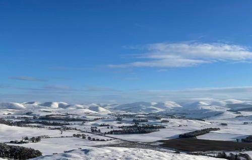an aerial view of a town in the snow at The New Farmhouse in Biggar