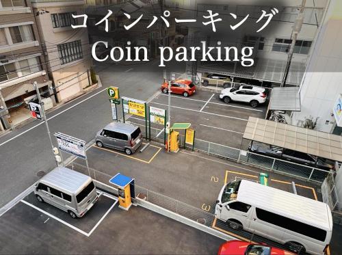 a view of a city with cars parked at a gas station at GR HONKAWA - Global Resort Hotel in Hiroshima