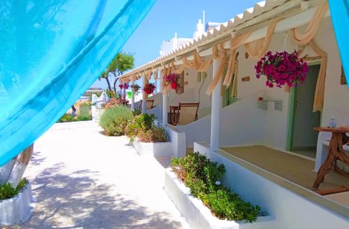 a house with flowers on the side of it at Errika's Sweet Home in Provatas