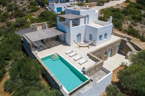 an aerial view of a villa with a swimming pool at VILLA ERIS in Agios Georgios