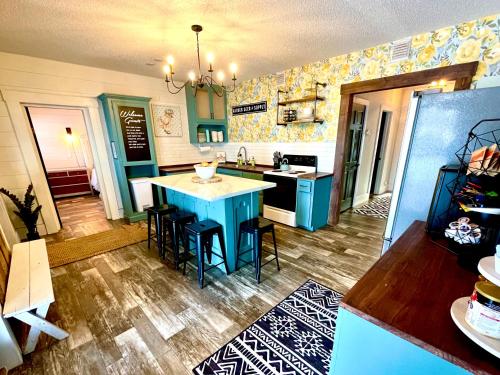 a kitchen with a blue island in a room at Nokasippi on 9 Brainerd Cabin and Cottage Sleeps up to 15 in Brainerd