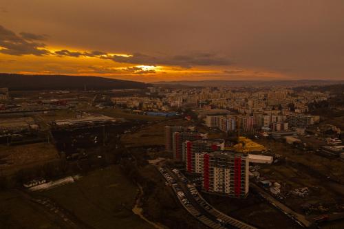 an aerial view of a city at sunset at The Perfect Space - NEW1Bedroom - Bicycle & Parking in Târgu-Mureş