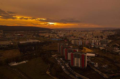 an aerial view of a city at sunset at The Perfect Space - NEW1Bedroom & Parking in Târgu-Mureş