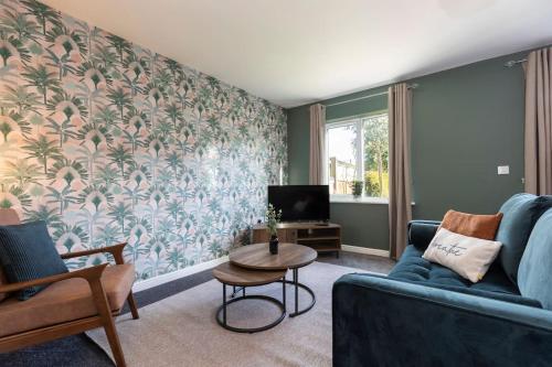 a living room with a couch and a table at Lakeland House in Hartlepool