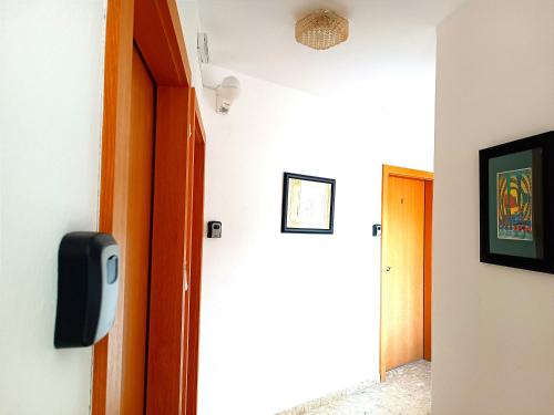 a room with a door and a tv on a wall at Gasthof Zemlinski Family Room in Payerbach