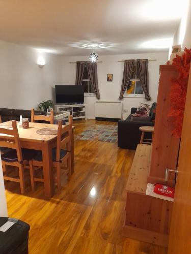 a living room with a table and a couch at Glastonbury town center-entire apartment in Glastonbury
