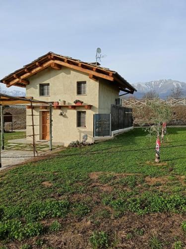 a small child standing in front of a house at 'L ciabot 'd Ginota in Barge