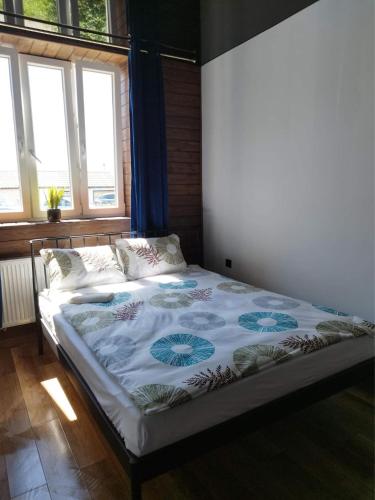 Llit o llits en una habitació de Mini apartament Giżycko