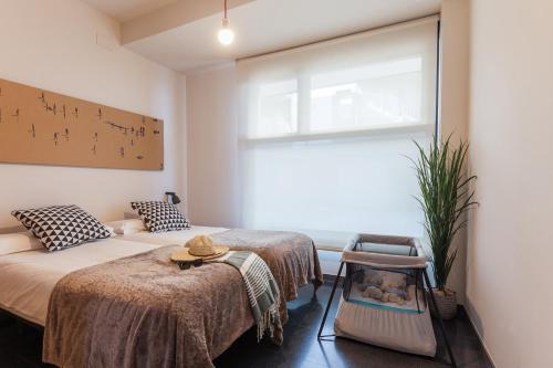 Katil atau katil-katil dalam bilik di Apartamentos Dada