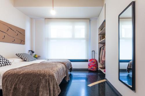 Katil atau katil-katil dalam bilik di Apartamentos Dada
