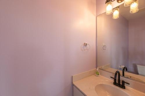 a bathroom with a sink and a mirror at Ocean Aire in Knotts Island