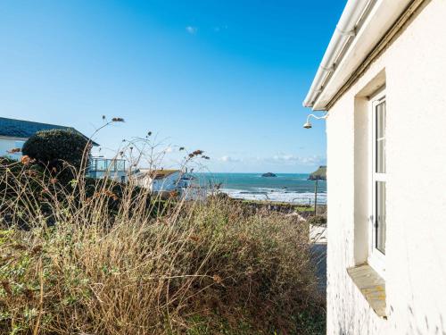 a view of the beach from a house at Pinewood Flat 5 in Polzeath