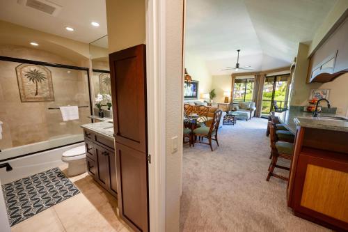 a kitchen and living room with a dining room at Grand Champions Golf Villas 94 in Wailea