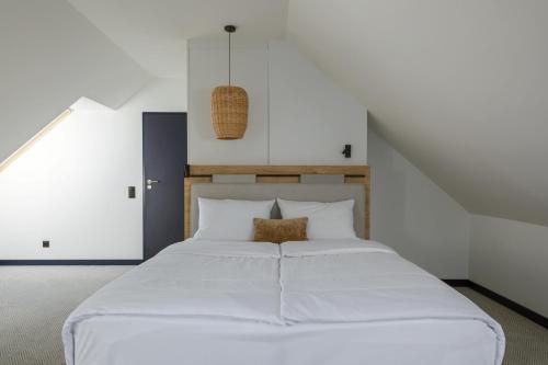 Postel nebo postele na pokoji v ubytování Hotel Saltic Resort & Spa Łeba
