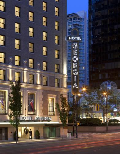 a hotel sign in front of a building at Rosewood Hotel Georgia in Vancouver