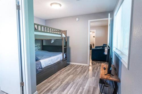 a small room with a bunk bed and a hallway at Tribesman #18 - Mr Brightside - on Table Rock Lake in Branson