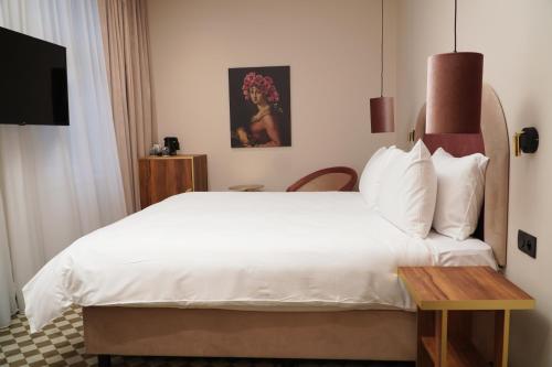 מיטה או מיטות בחדר ב-Hotel Pietryna