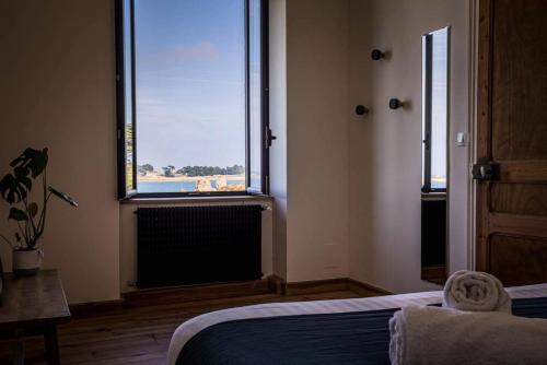 Katil atau katil-katil dalam bilik di Résidence Hjem Petite-port Blanc - Maisons & Villas pour 4 Personnes 214
