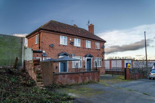 a brick house with a fence in front of it at 1 bedroom flat Halesowen in Halesowen