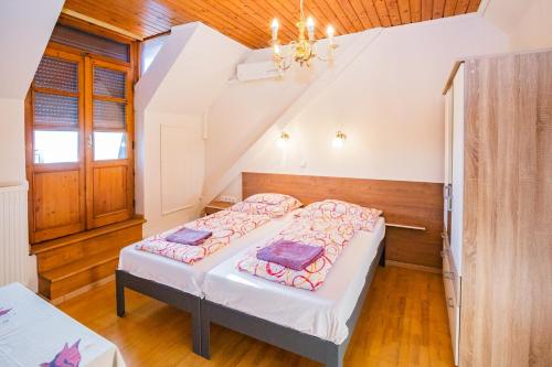a bedroom with a bed in a attic at Mohacsi Guesthouse in Budapest
