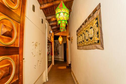 a hallway in a house with a chandelier at Sangay Spa Hotel in Baños