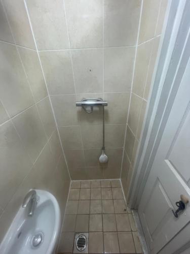 a small bathroom with a sink and a shower at 11 Chalvey Road east sl12ll in Slough