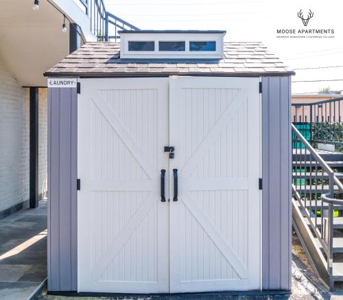 a white garage door with a window on top at The Moose #6 - Modern Luxe Studio with Free Parking & King Bed in Memphis
