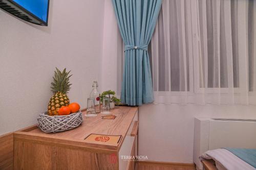 a room with a table with fruit on it at Хотел Терра Роза in Karlovo