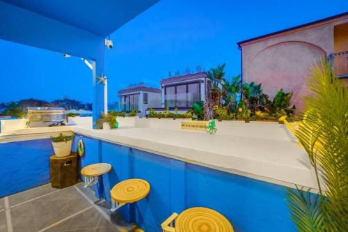 an outdoor bar with stools on a house at Ocean View Blue Mission Beach Paradise in San Diego