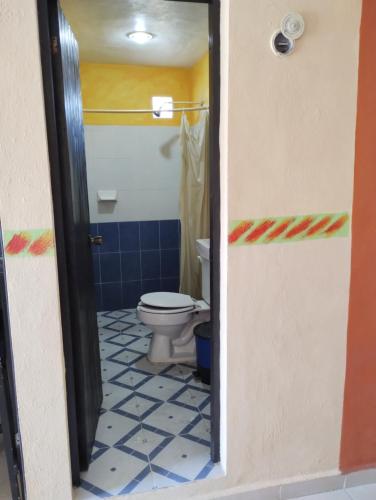 a bathroom with a toilet in a room at Las Villas Champoton in Champotón