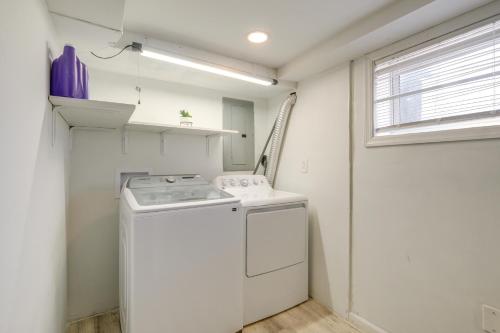 a white kitchen with a stove and a window at Oxon Hill Rental about 3 miles to MGM National Harbor in Oxon Hill