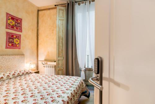 Ένα ή περισσότερα κρεβάτια σε δωμάτιο στο Hostal Artistic B&B