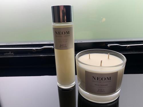 two candles sitting next to each other on a table at Luxury 5-Bedroom Retreat in the Heart of Cheshire in Hale