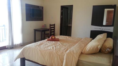 Ένα ή περισσότερα κρεβάτια σε δωμάτιο στο DSTAY Kost Bali