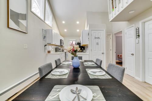 a kitchen and dining room with a table and chairs at Walk to Lake Tobyhanna Home with Hot Tub and Fire Pit in Tobyhanna