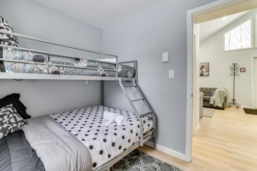 a bedroom with a bunk bed in a room at Walk to Lake Tobyhanna Home with Hot Tub and Fire Pit in Tobyhanna