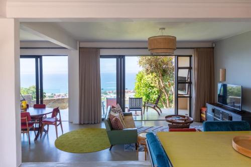 a living room with a view of the ocean at Cape St. Blaize in Mossel Bay