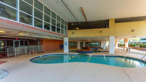 a large swimming pool inside of a building at Malibu Pointe 1001 Second row ocean view-Crescent Beach Section in Myrtle Beach