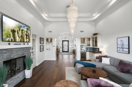 a living room with a couch and a fireplace at Golf Sim & Putting Green - Rooftop with 360 Views in Scottsdale