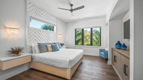 a bedroom with a bed and a window at Shaker of Salt in Siesta Key
