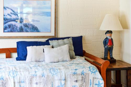 a bedroom with a bed with a mask on it at Beach House @ The Reef in Chincoteague
