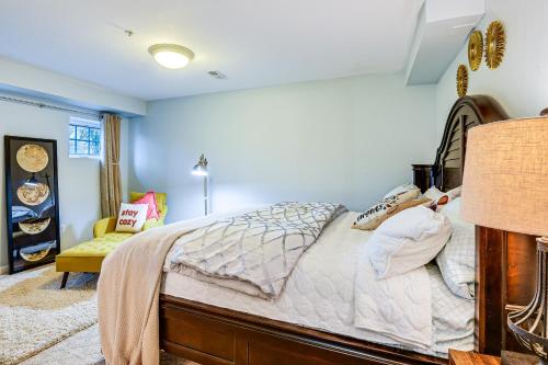 a bedroom with a bed and a couch in a room at Pet-Friendly DC Area Condo with Yard! in Silver Spring