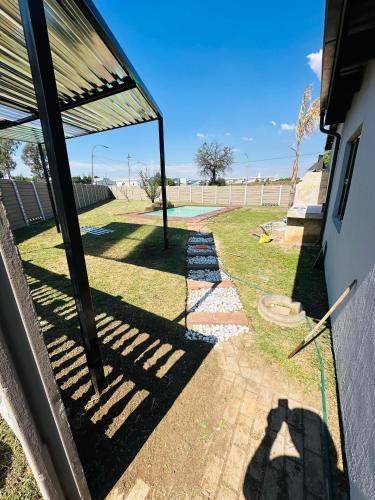 a view of a yard with a patio at Mayberry Heights in Alberton