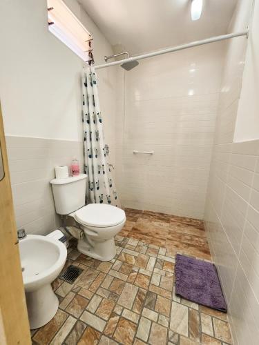 a bathroom with a toilet and a sink at Departamento DORREGO, A estrenar in Guaymallen